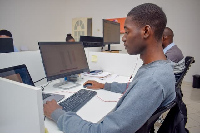 Young African professional working with computer technology